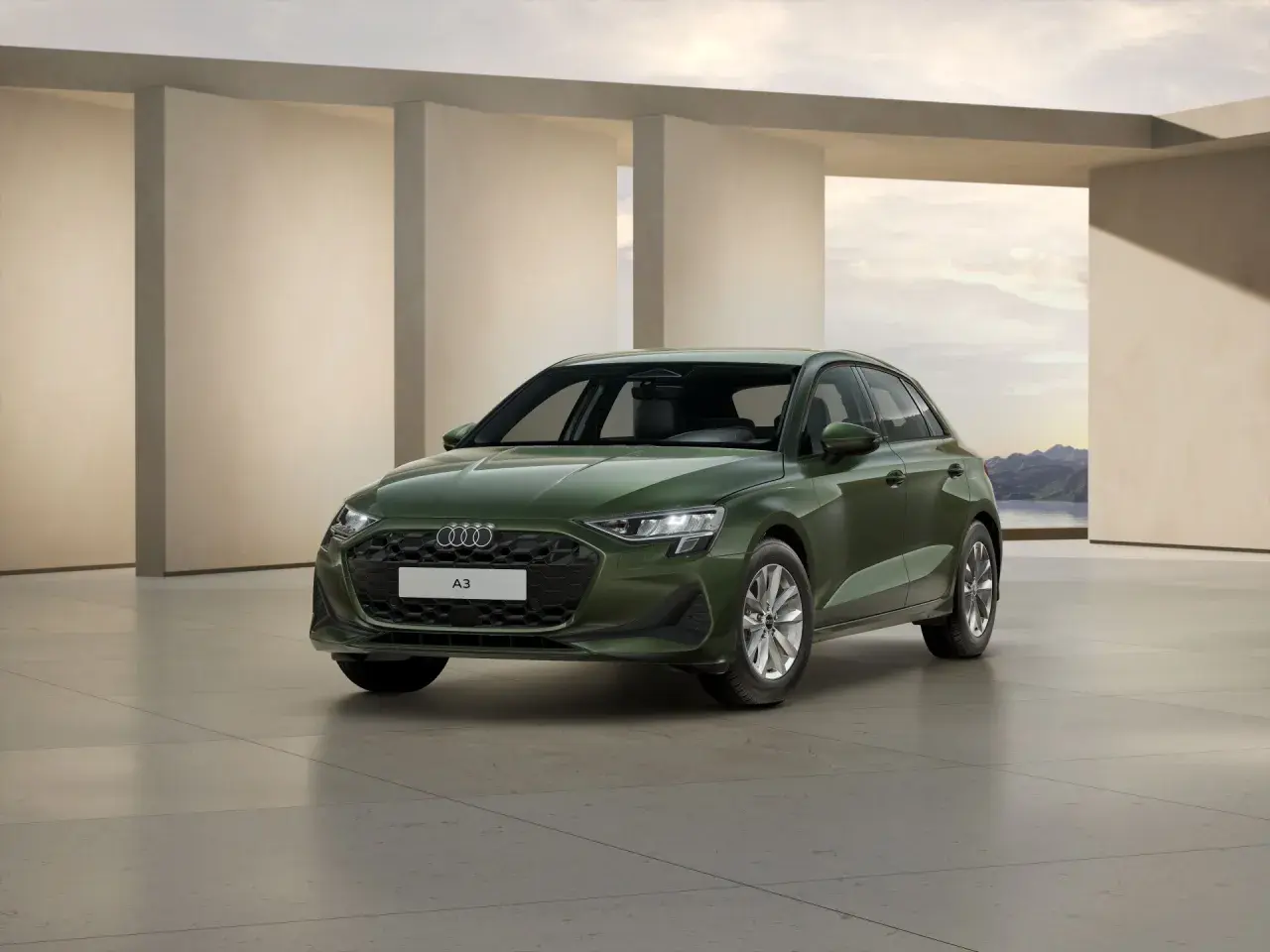 Zielony Audi A3, zgrabny i nowoczesny, gotowy na podróż. Jego wymiary a3 idealnie wpasowują się w miejski krajobraz.