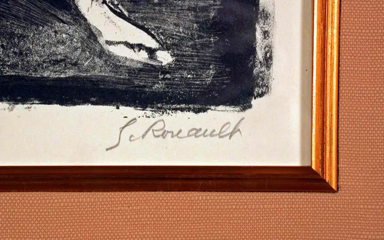 Signature manuscrite "G. Rouault" sur une estampe encadrée.