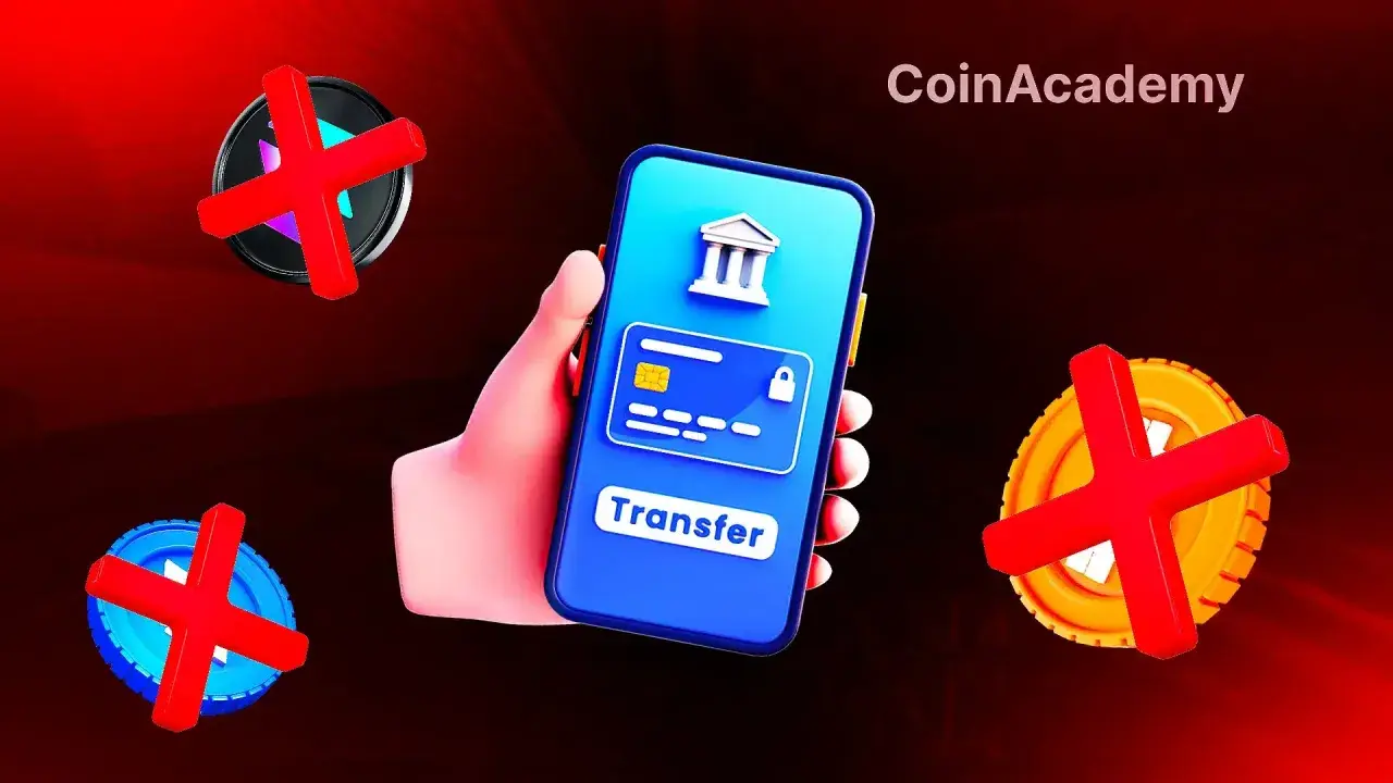 Main d'une personne tenant un smartphone affichant un virement bancaire bloqué. Des symboles de croix rouges sur des pièces suggèrent un problème avec les transactions N26.