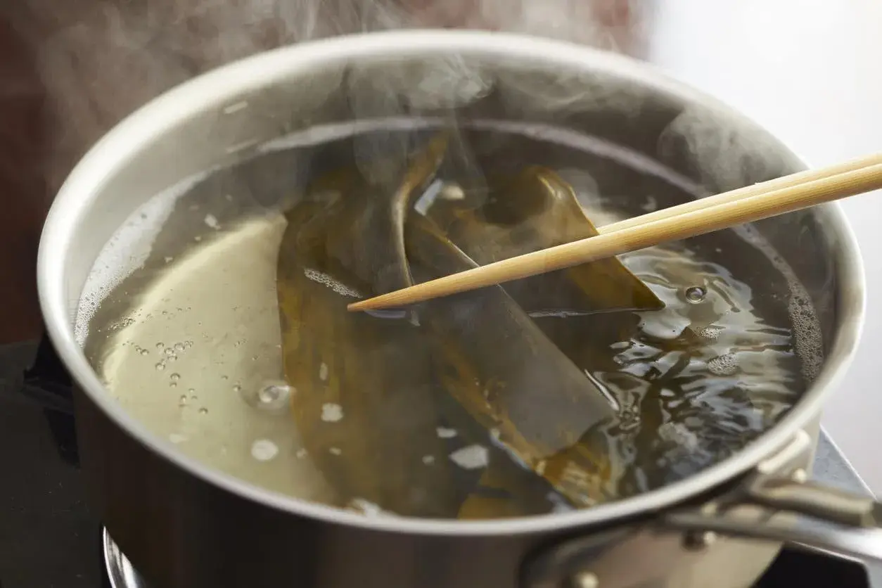Kombu is steeped in simmering water, a key step for many delicious kombu recipes.