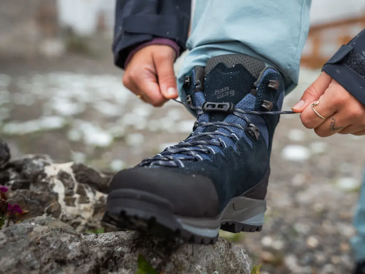 Lacing up new hiking boots. Wondering how long to break in shoes for comfort on the trail.