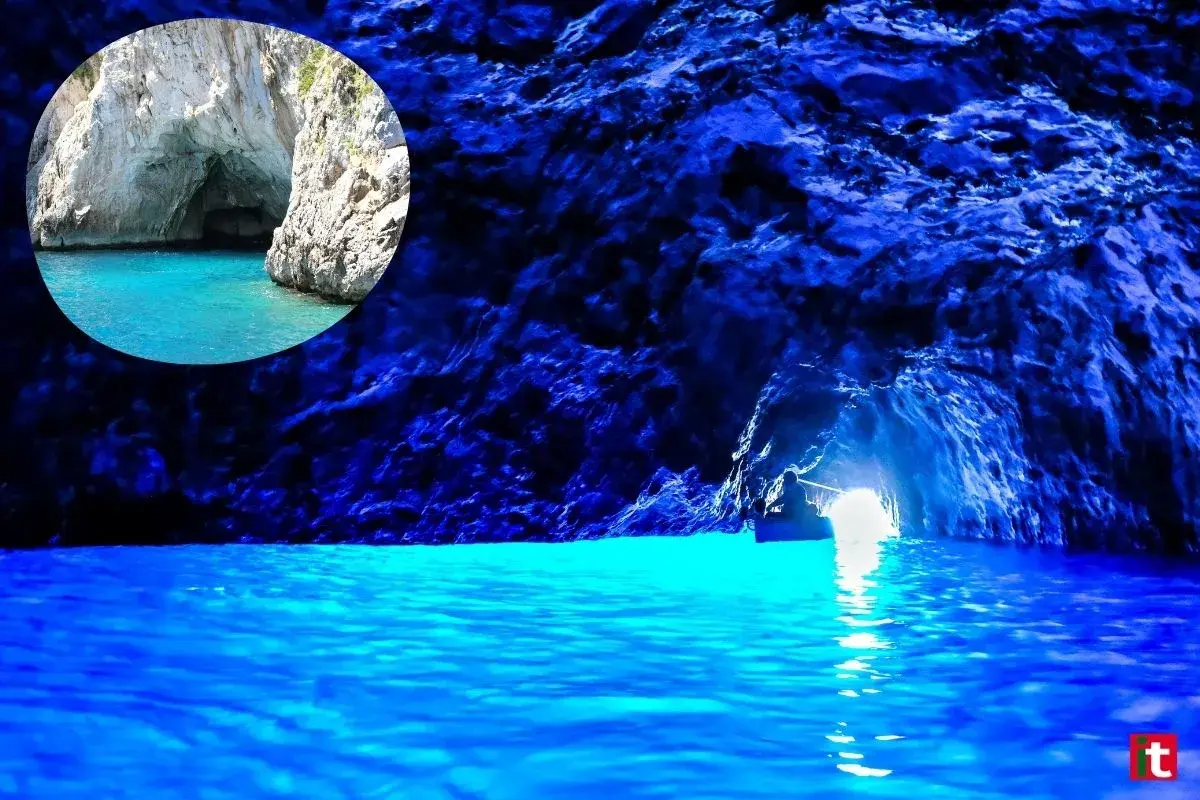 Un piccolo barca entra nella magica gruta azul, illuminata da un'intensa luce blu che riflette sull'acqua cristallina.