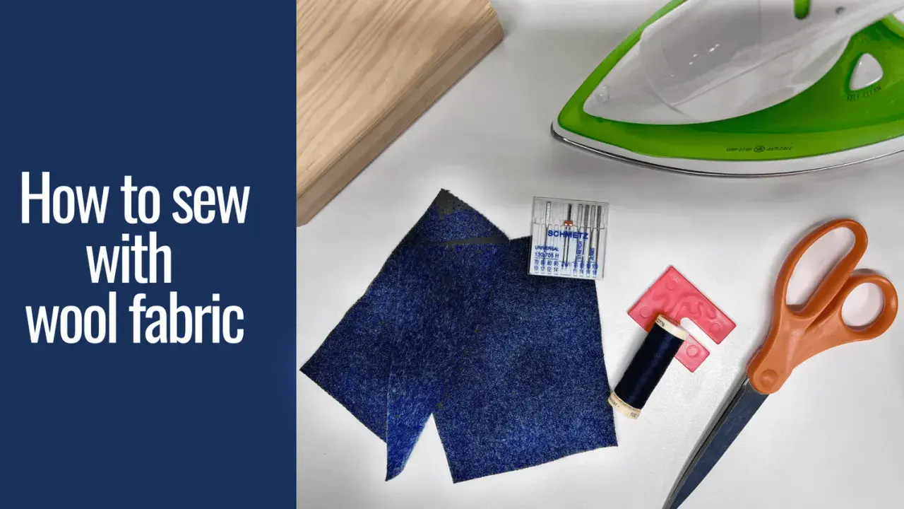 Gather supplies to learn how to sew wool fabric: dark blue wool scraps, thread, needles, scissors, an iron, and a wooden block.