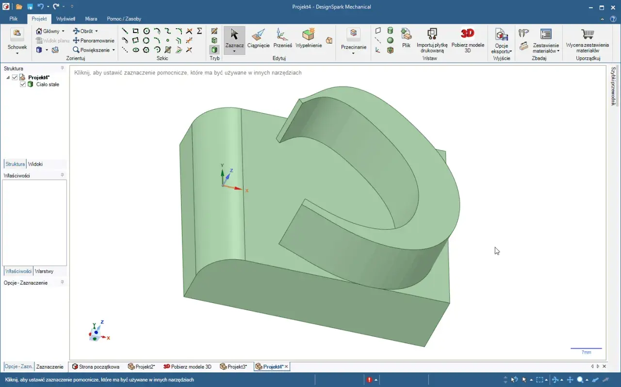 Projekt 3D w programie darmowy CAD. Widoczny zielony model bryły z zaznaczonymi osiami współrzędnych.