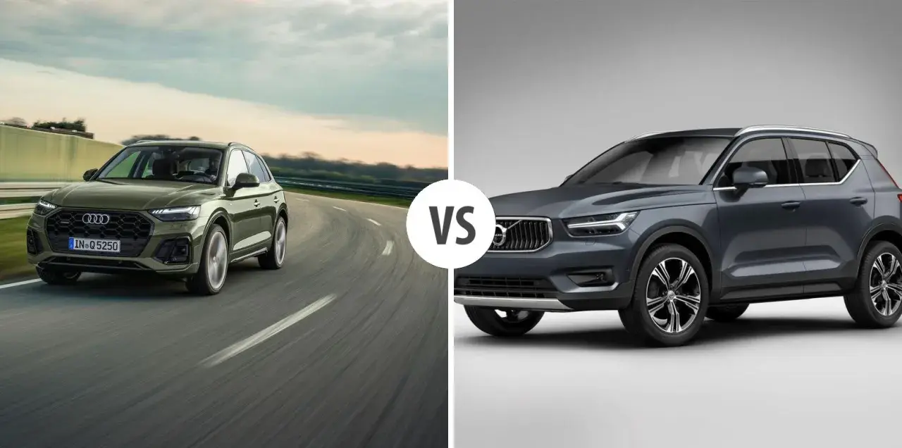 Zielony Audi Q5 na drodze, obok szarego Volvo. Porównanie audi q5 wymiary i możliwości.