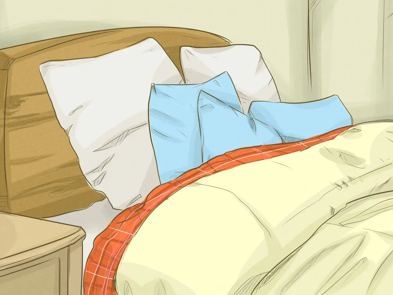 Cozy bed with pillows and a plaid blanket, perfect for learning how to get warmer in bed.