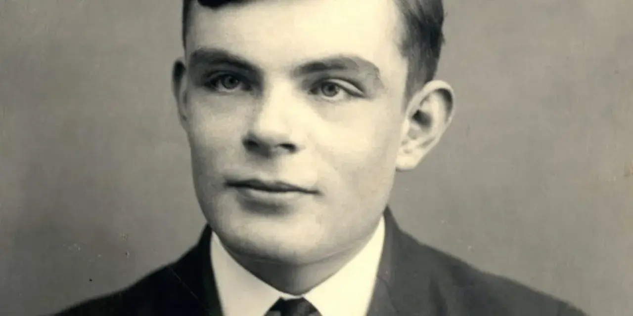 A young Alan Turing portrait, looking thoughtfully into the distance. This image captures the visionary mathematician who cracked Enigma.