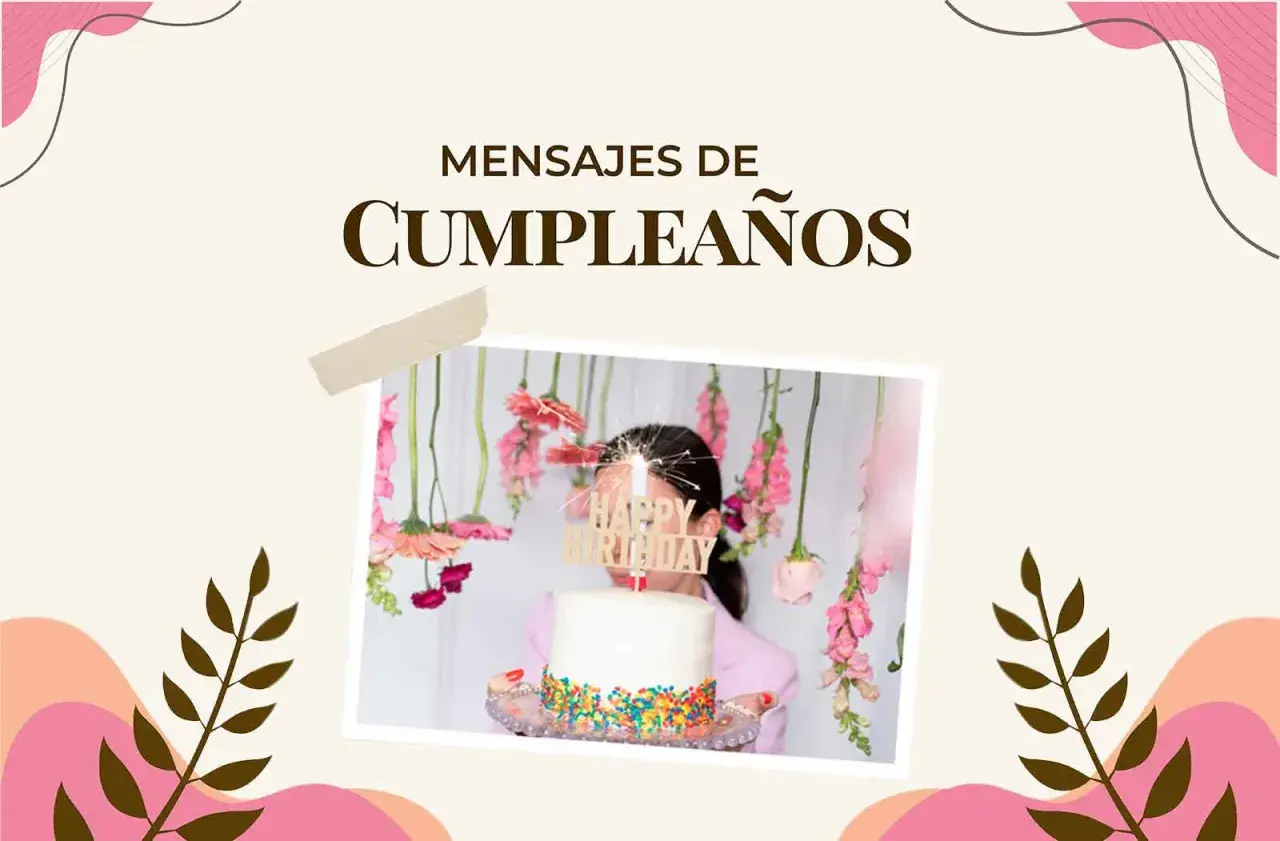Un pastel blanco con chispas de colores y un letrero "Happy Birthday" adornado con flores colgantes. Ideal para encontrar frases de feliz cumpleaños.