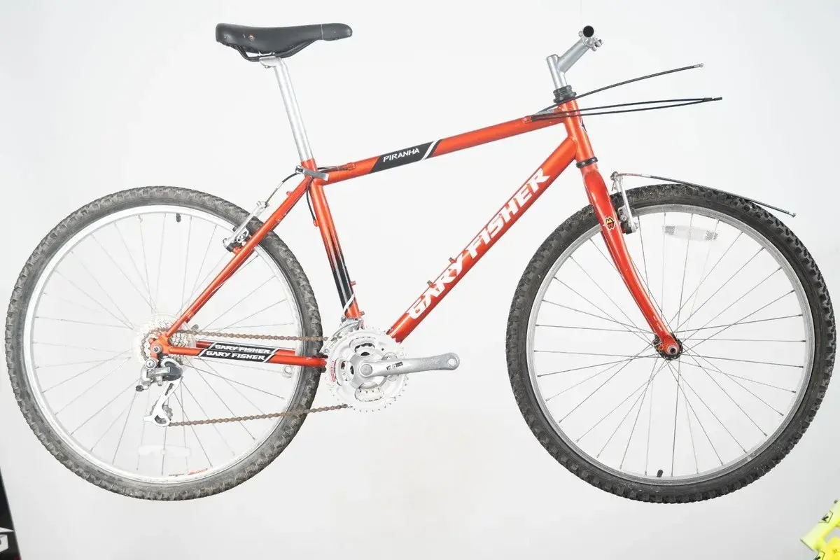 A vintage red Gary Fisher Piranha mountain bike, ready for adventure.