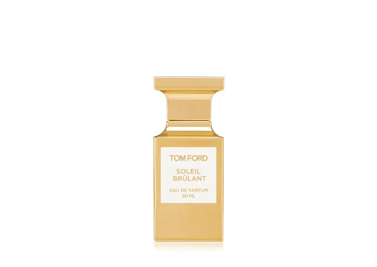Złota butelka perfum Tom Ford Soleil Brûlant, emanująca ciepłem i luksusem.