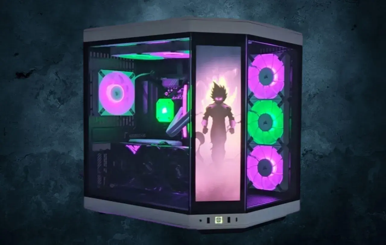 Ein Gaming-PC mit ARGB-Beleuchtung, die einen Anime-Charakter in Szene setzt. Die Lüfter leuchten in Pink und Grün, ein starker Kontrast zu reinem RGB.
