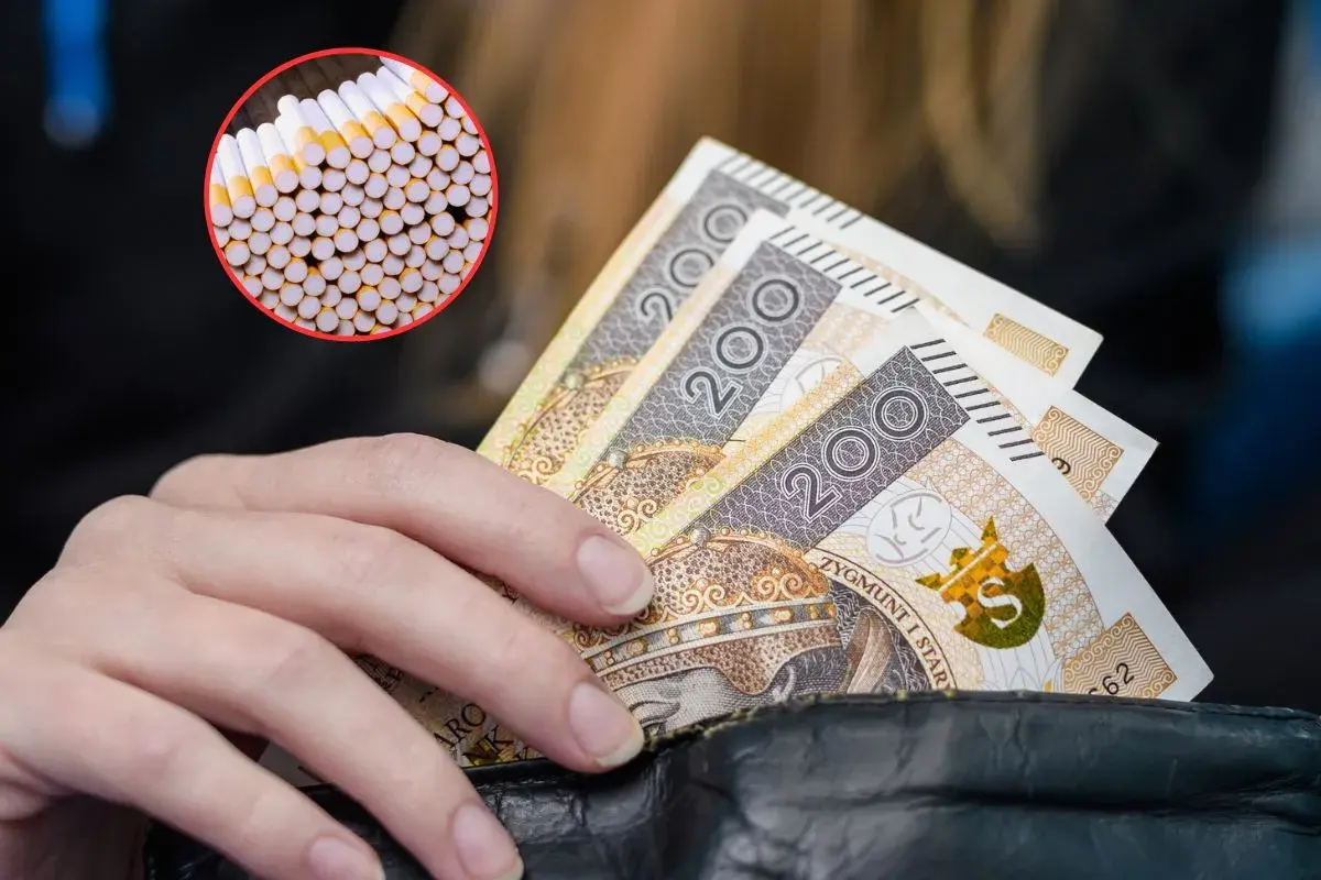 Dłoń trzyma banknoty 200 zł, obok kółko z papierosami. Akcyza na e papierosy wpływa na ceny.