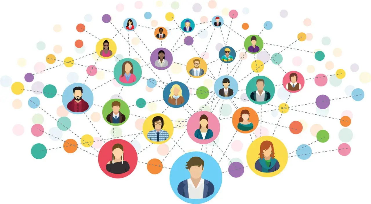 Wizualizacja pokazuje, jak działa networking: połączeni ludzie tworzą sieć kontaktów, wymieniając się pomysłami i budując relacje.