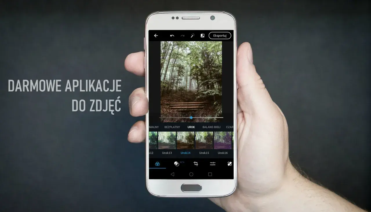 Dłoń trzyma smartfon z aplikacją do edycji zdjęć. Na ekranie widać leśny krajobraz i dostępne filtry, idealne dla fotografów szukających darmowych aplikacji.