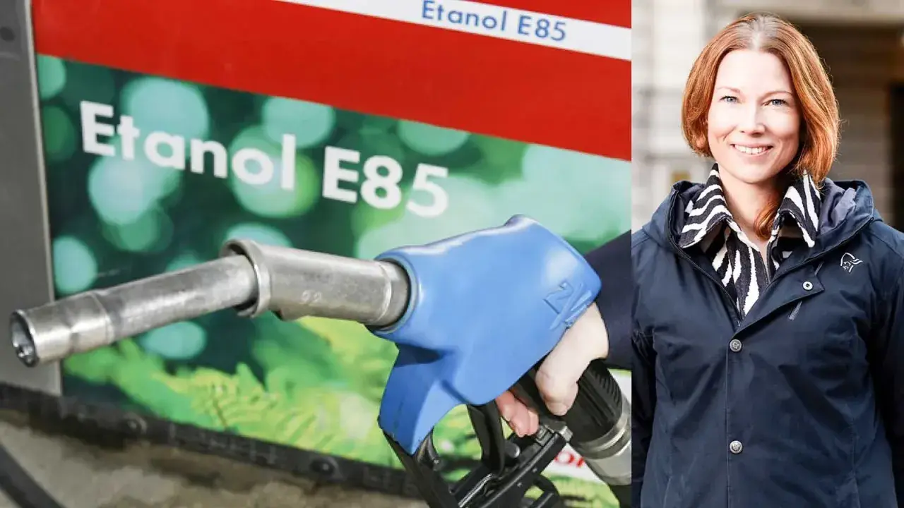 En kvinna ler vid en pump för etanol E85.