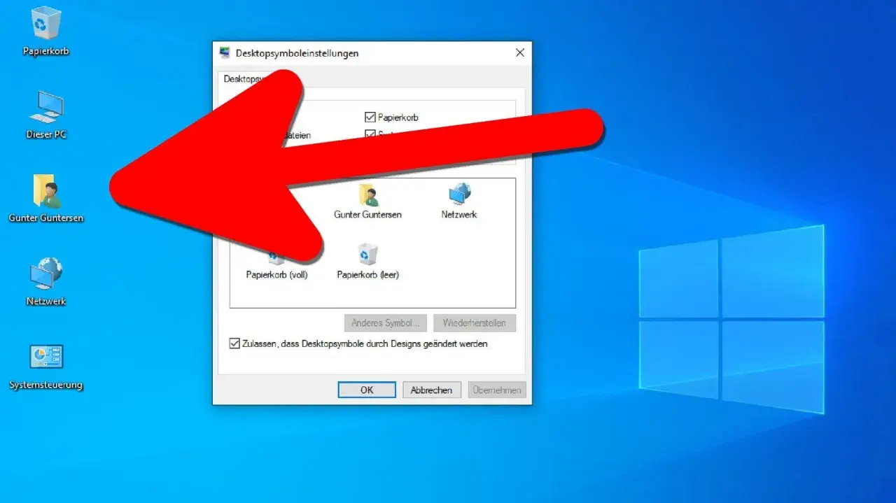 Roter Pfeil zeigt auf das Fenster "Desktopsymboleinstellungen" im Windows 11 Desktop anzeigen. Hier können Sie Symbole wie Papierkorb oder Netzwerk auswählen.