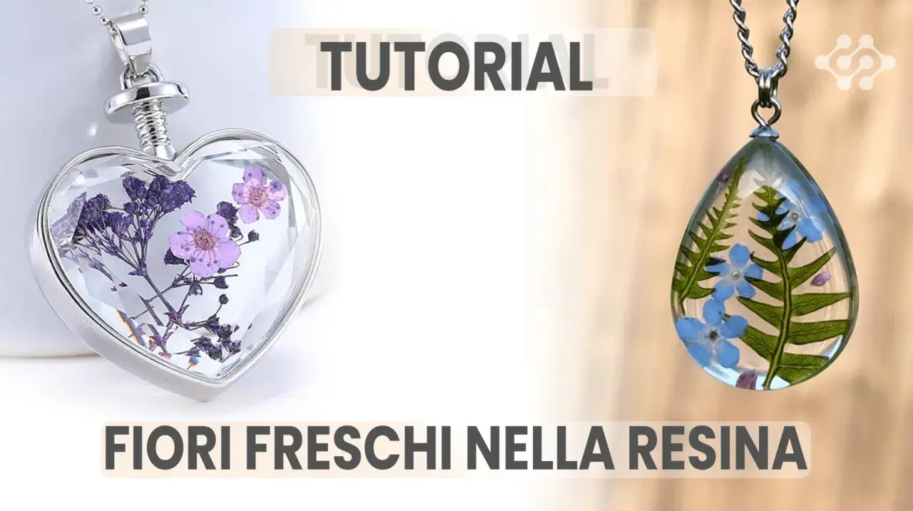 Ciondoli a forma di cuore e goccia con fiori freschi nella resina, perfetti per un tutorial creativo.