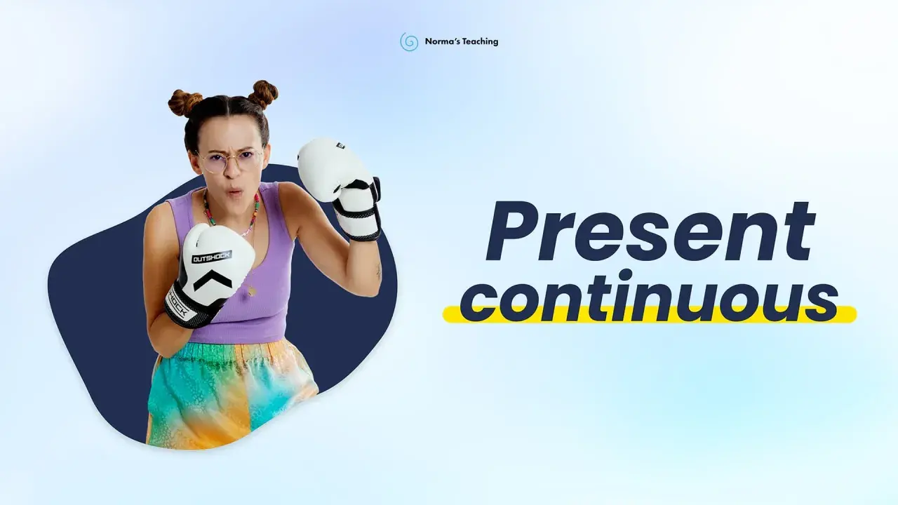 Ragazza con guantoni da boxe, pronta a combattere, mentre impara il **present continuous** e il **present simple**.