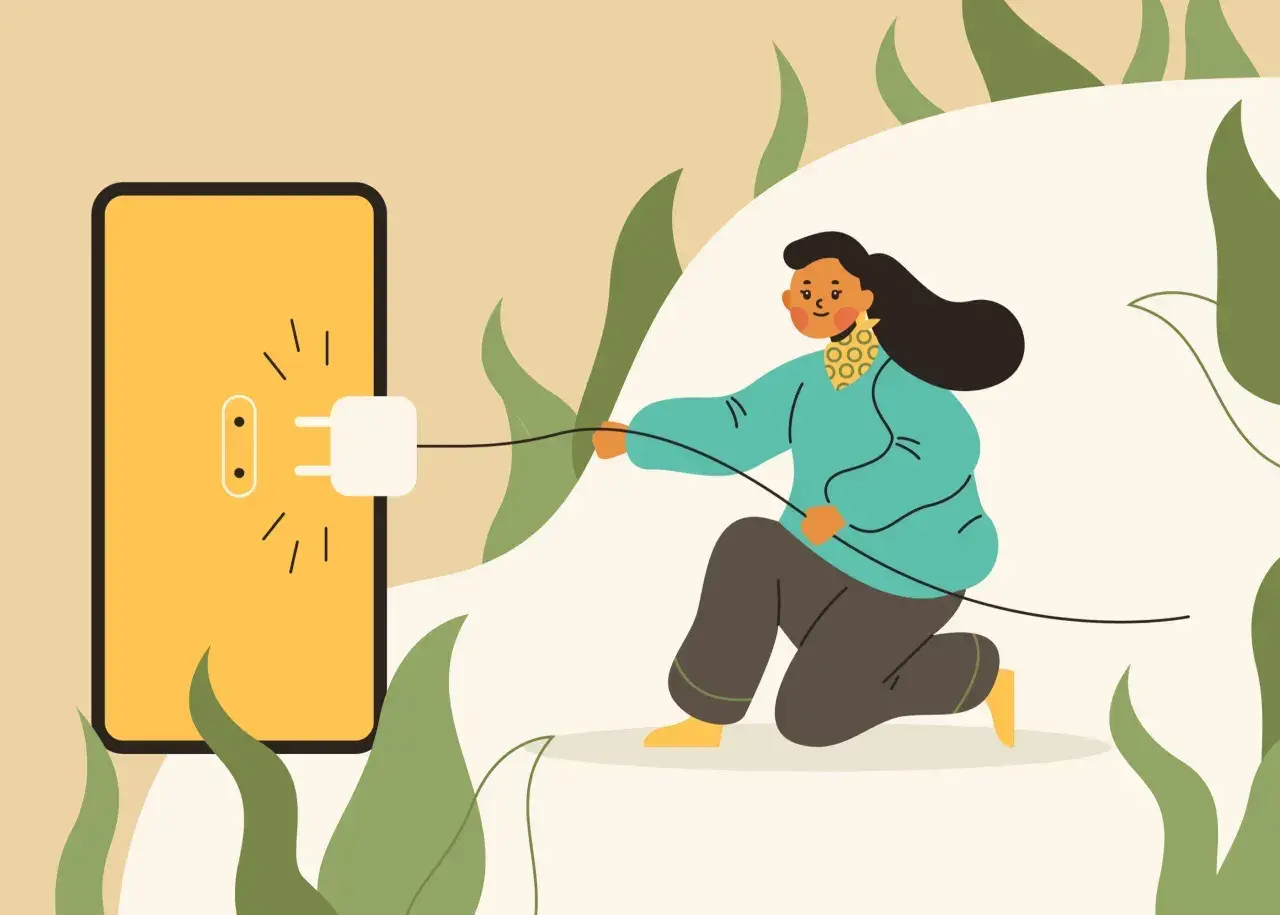Kobieta podłącza wtyczkę do gniazdka na ekranie telefonu, symbolizując zużycie energii. Zastanawiasz się, ile prądu zużywa komputer?