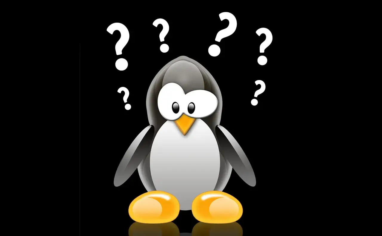 Pingwin z Linuksa otoczony znakami zapytania. Czy potrzebuje linux antivirus?