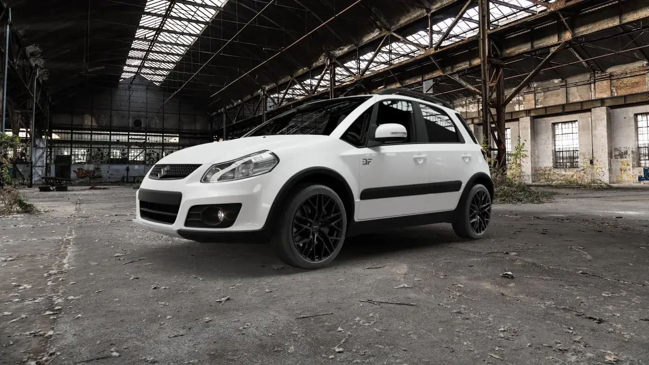 Vit Suzuki SX4 med svarta fälgar står i en övergiven lagerlokal. Kanske ett problem med att hitta en ny ägare?