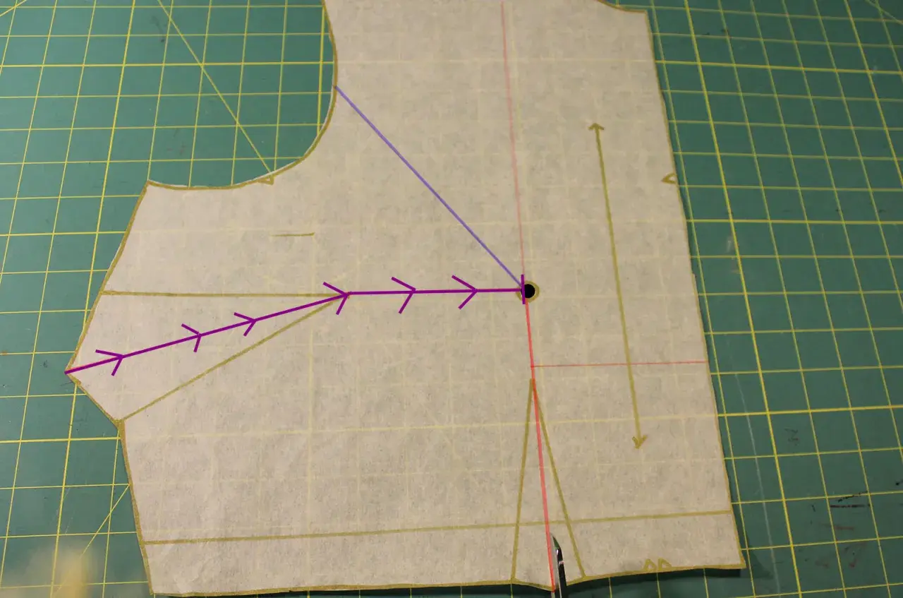 Sewing pattern piece showing how to shape bust darts. Purple arrows indicate the direction of the dart manipulation.