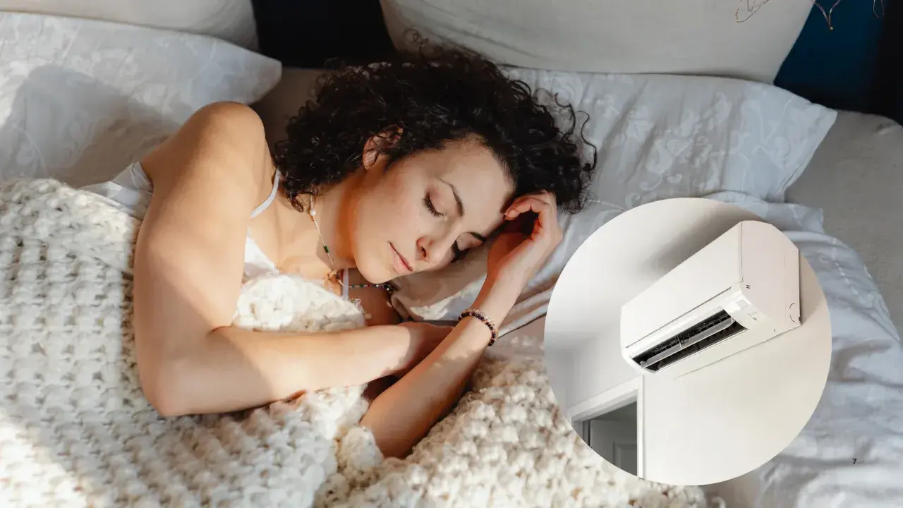 Mujer durmiendo plácidamente bajo una manta, con el aire acondicionado a 22 grados creando un ambiente perfecto para el descanso.