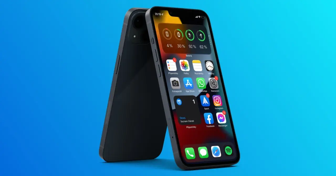 Ekran główny iPhone z widocznymi ikonami aplikacji i widżetem baterii.
