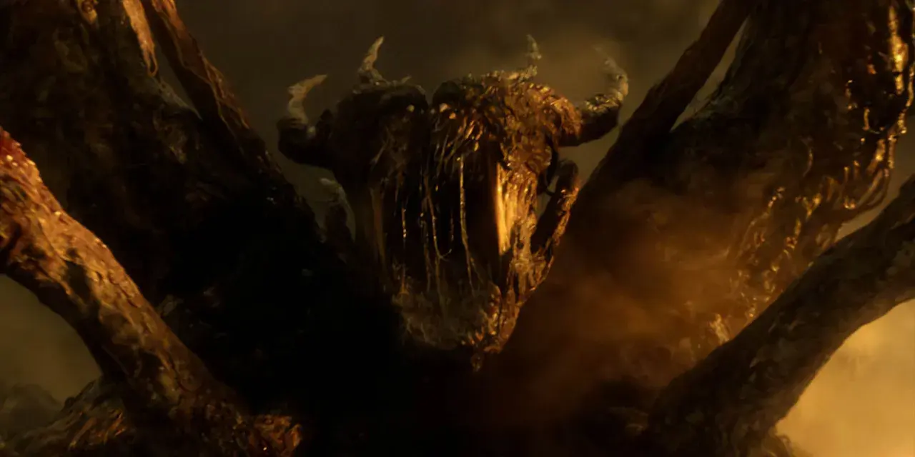 Le flagelleur mental de Stranger Things, une créature cauchemardesque aux cornes et aux tentacules, émerge des ténèbres.