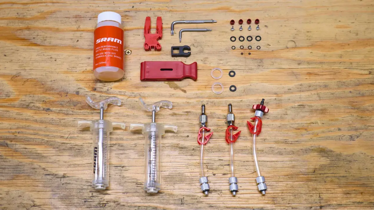 SRAM brake flush and bleed kit with syringes, fluid, and tools. Essential for maintaining hydraulic disc brakes.