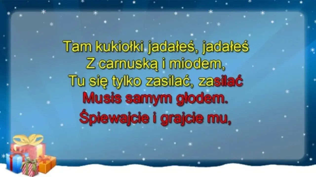 Golec uorkiestra śpiewa "oj, maluśki, maluśki tekst" na tle zimowego nieba z prezentami.
