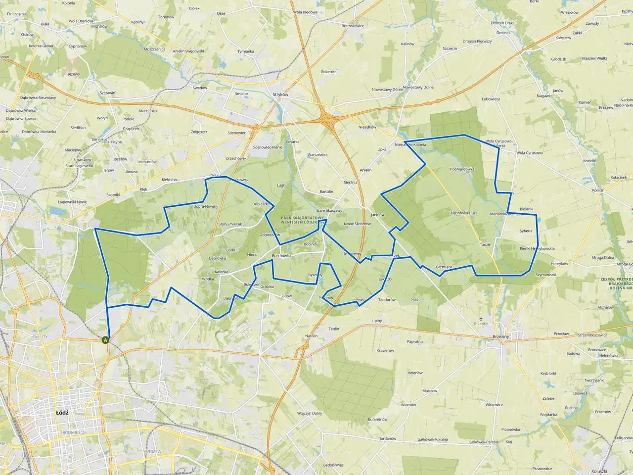 Mapa z zaznaczoną trasą rowerową wokół Łodzi, przechodzącą przez tereny zielone i miejscowości.