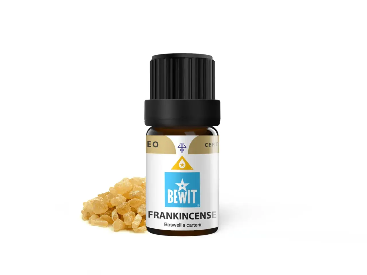 Butelka olejku eterycznego z kadzidłowcem (frankincense) obok żywicy. Elemi, czyli kadzidłowiec, to cenny składnik.
