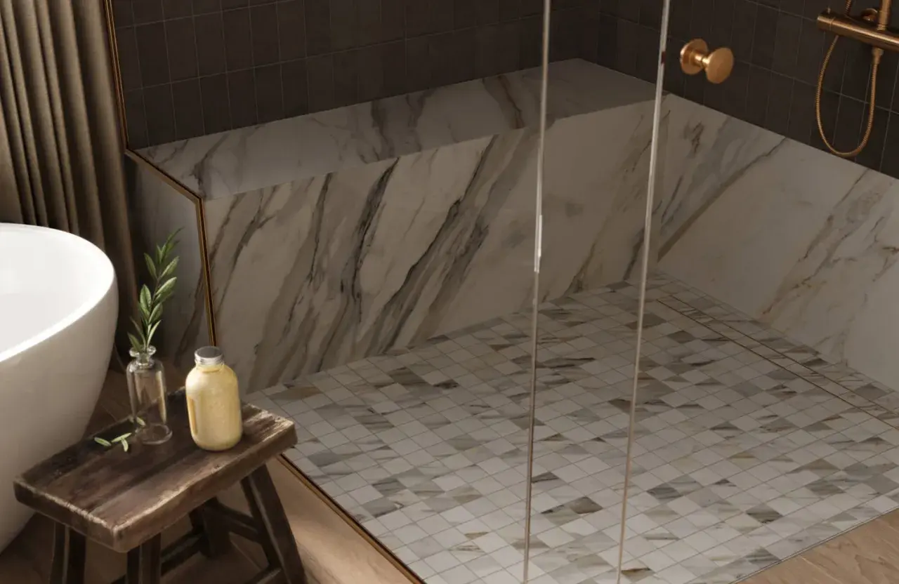 Elegant shower floor designs featuring a mosaic of small, diamond-shaped tiles in white and earth tones, complementing the marble walls.