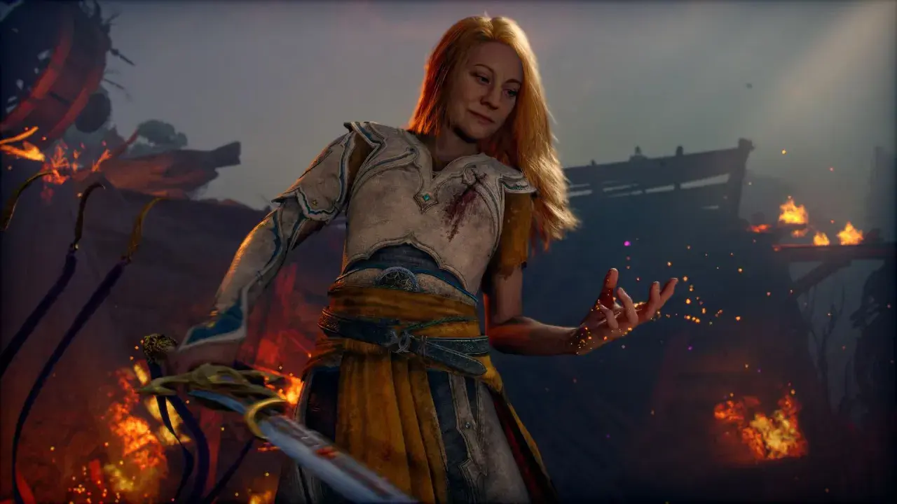 La guerriera bionda, con un'armatura ferita, evoca scintille in un paesaggio in fiamme. Un nuovo God of War è in arrivo.