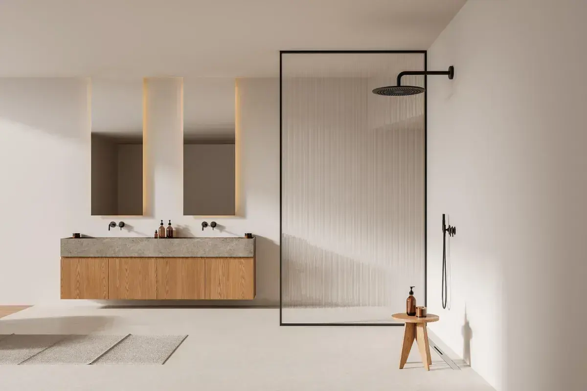 Salle de bain moderne avec double vasque et douche à l'italienne. L'ambiance est épurée, invitant à installer une douche à l'italienne.