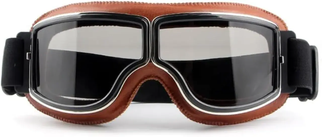 Occhiali biker in pelle marrone con lenti scure, perfetti per un look retrò e avventuroso.