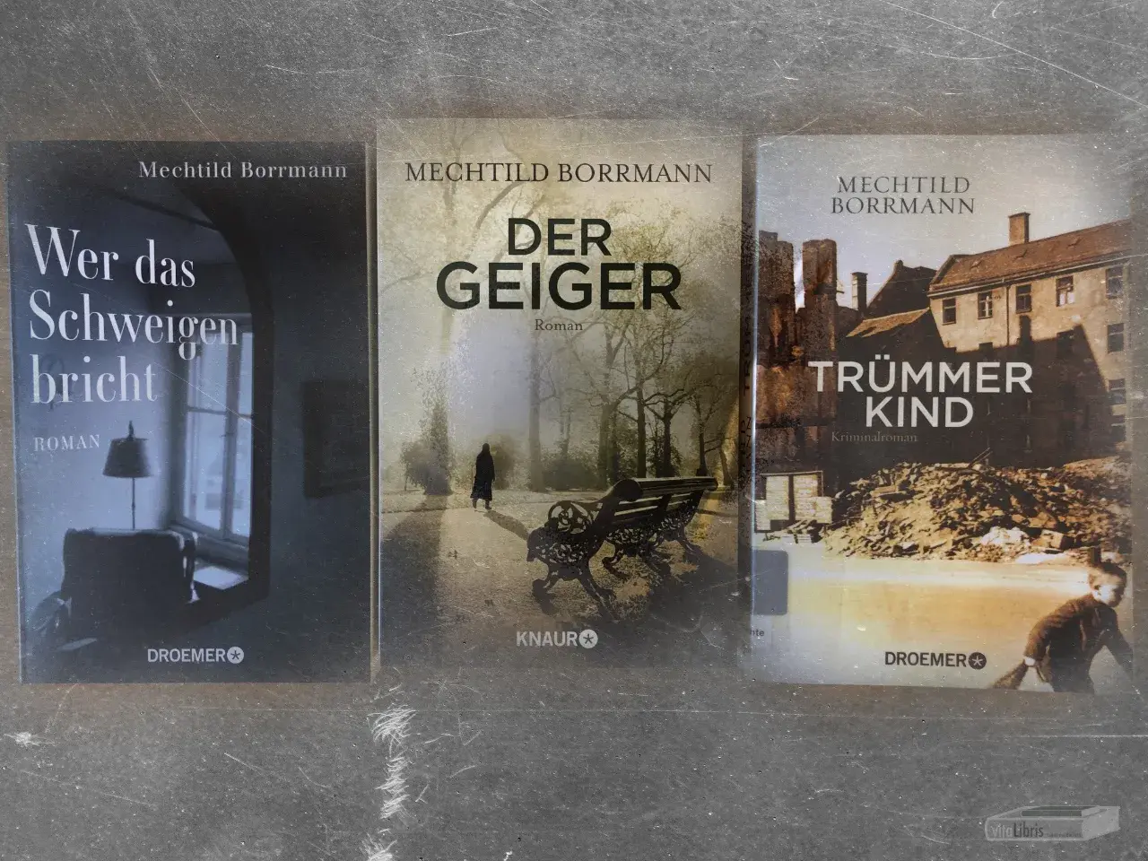 Drei Romane von Mechthild Borrmann: "Wer das Schweigen bricht", "Der Geiger" und "Trümmerkinder".