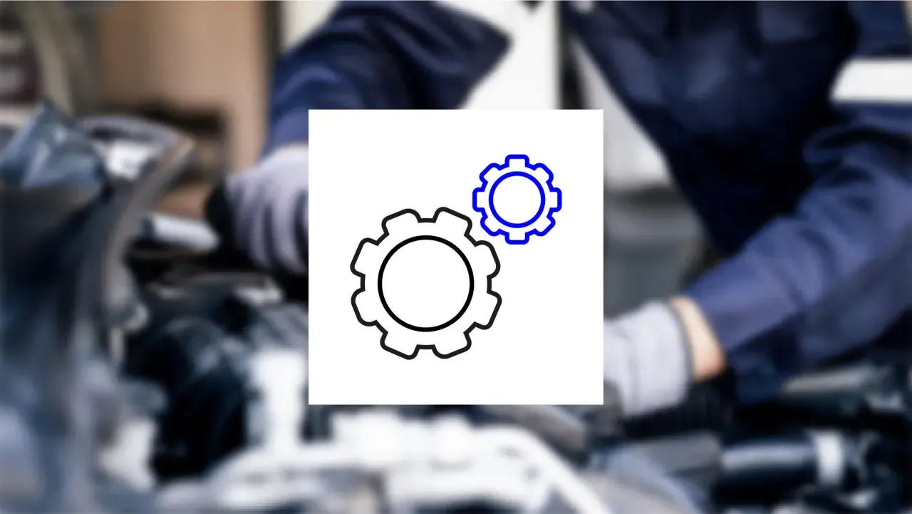 Mechanik bada usterkę. Ikona kół zębatych symbolizuje mechanizm, który może być przyczyną ujemnych korekt paliwowych.
