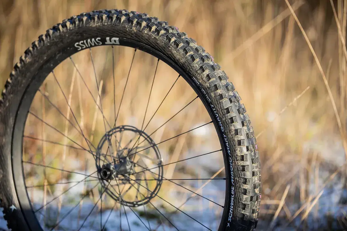 Close-up of a DT Swiss wheel with a Schwalbe Magic Mary tire, ready for a gravity-defying review.