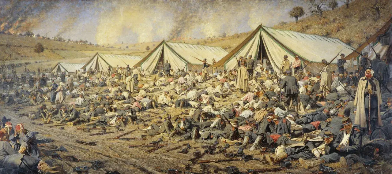 A battlefield scene by Vasily Vereshchagin depicts rows of tents and countless fallen soldiers, some wounded, others deceased, amidst scattered weapons and smoke rising in the distance.