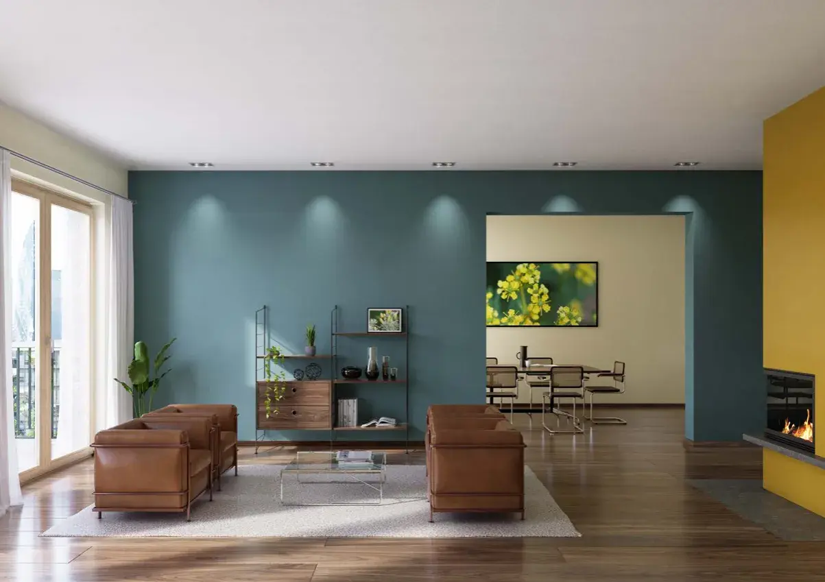 Modernes Wohnzimmer mit zwei Ledersofas, einem Regal und einem Essbereich. Die Wände sind in Petrol und Gelb gestrichen, was zeigt, was ist dispersionsfarbe.