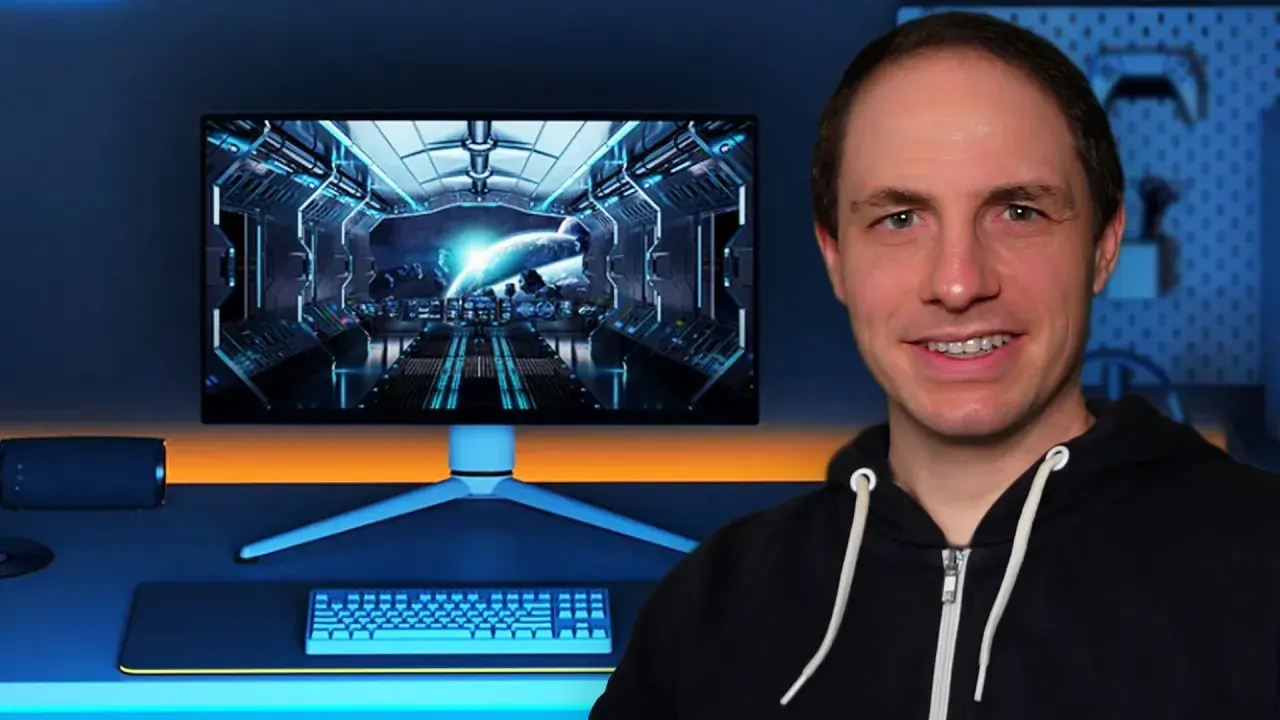 Mann vor einem Gaming-Setup mit Weltraum-Hintergrund auf dem Monitor. Die Frage, wie viel FPS das Auge sehen kann, wird hier visuell thematisiert.