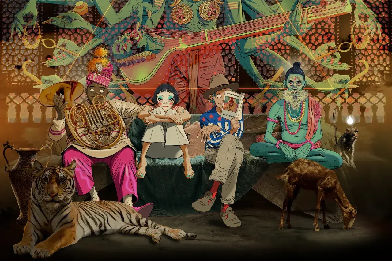 Gorillaz koncerty w Indiach? Postacie siedzą obok tygrysa, kozy i małpy, w tle hinduskie bóstwo.