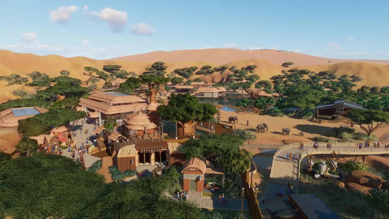 Vue aérienne d'un zoo inspiré de l'Afrique, avec des éléphants, des girafes, des bâtiments aux toits de chaume et des dunes en arrière-plan. Un exemple de configuration Planet Zoo.