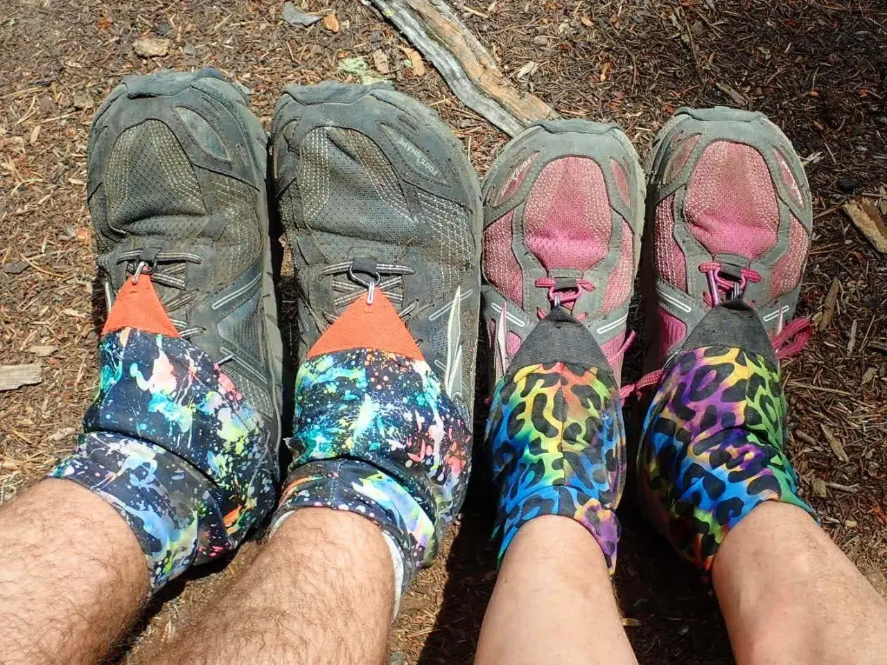 Four pairs of hiking shoes with colorful gaiters. The question "do boots run bigger than shoes" is irrelevant here.