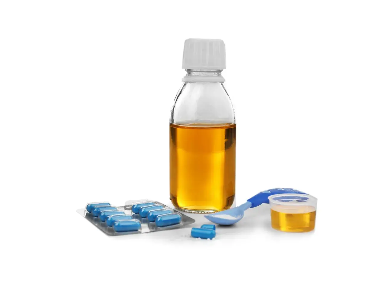 Flacone di sciroppo amoxicillina bambini, blister di capsule blu e misurino dosatore con polvere bianca.