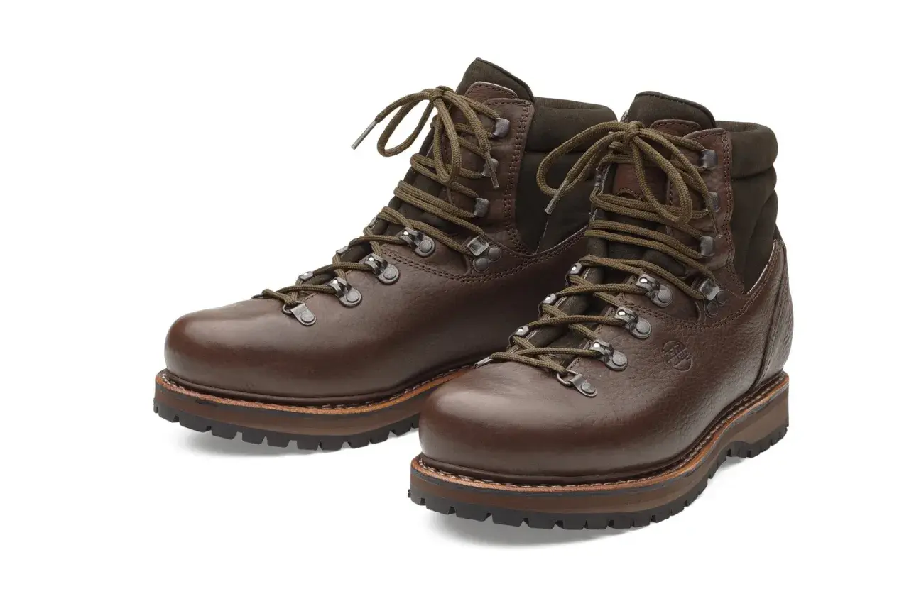 Brown leather hiking boots, crafted from durable yak leather, with sturdy soles and laces.