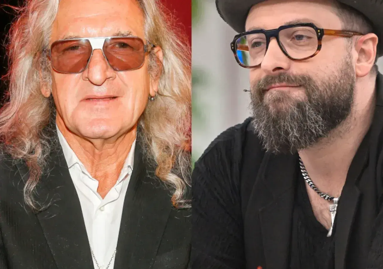 Dwaj artyści, jeden z długimi blond włosami i okularami przeciwsłonecznymi, drugi z brodą i okularami w stylu retro. Tworzą duet, który mógłby ułożyć perfect piosenki alfabetycznie.