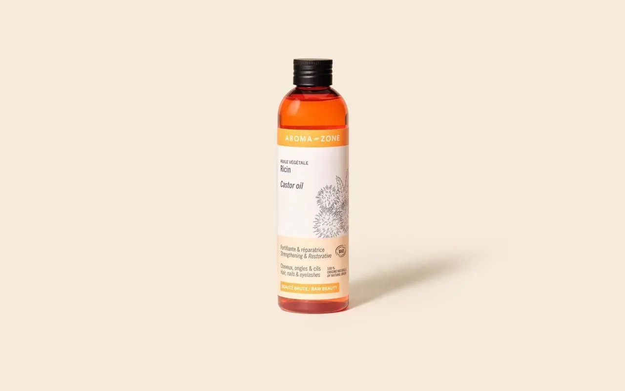 Bouteille d'huile de ricin Aroma-Zone, vantant ses bienfaits fortifiants et réparateurs pour cheveux, ongles et cils.